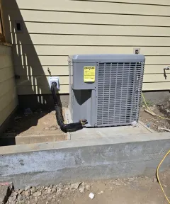 Outdoor HVAC unit beside a home