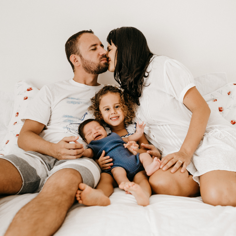 Family sitting together on a sofa